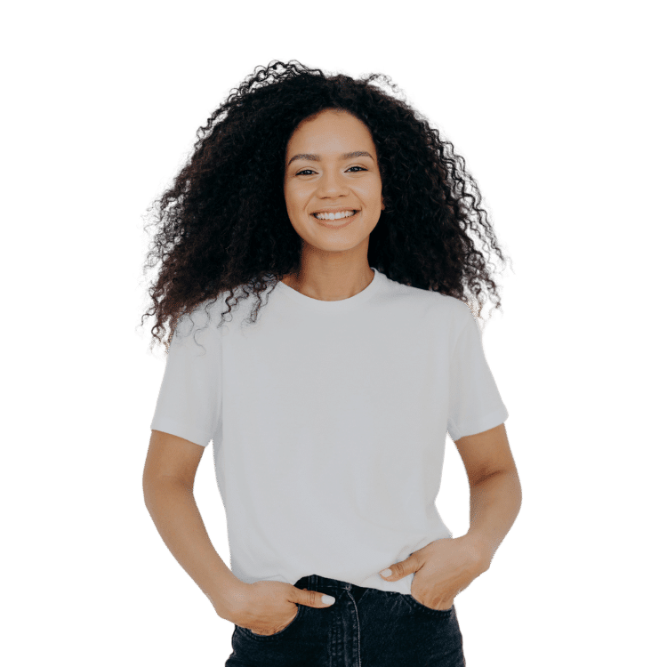 Happy Black woman with curly hair and a white t-shirt. She's excited to start her therapy journey with Rowan Center 